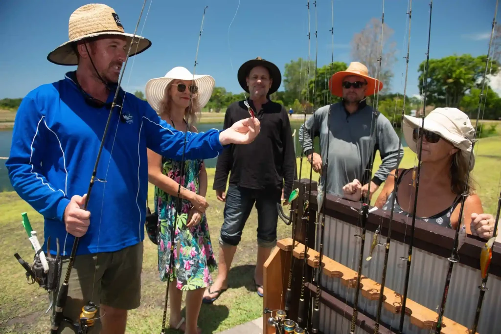 Group of people watching fishing instructor