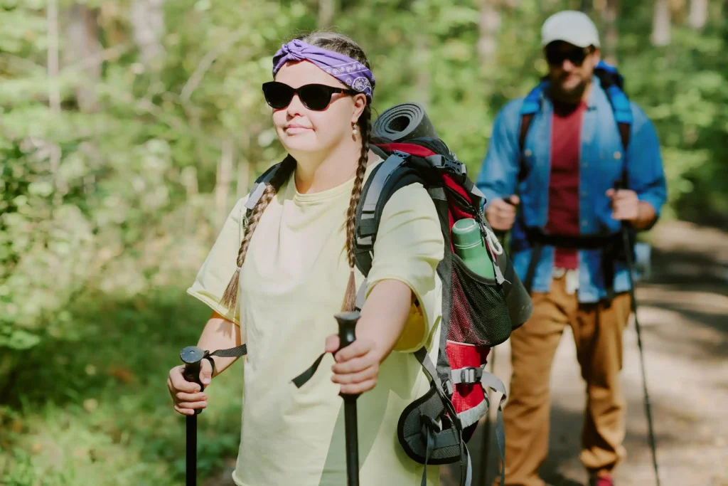Disabled woman with down syndrome on a hike with support worker